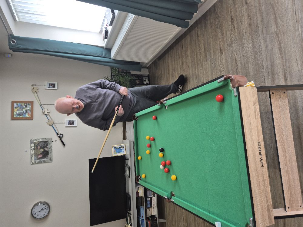 JE playing snooker at home